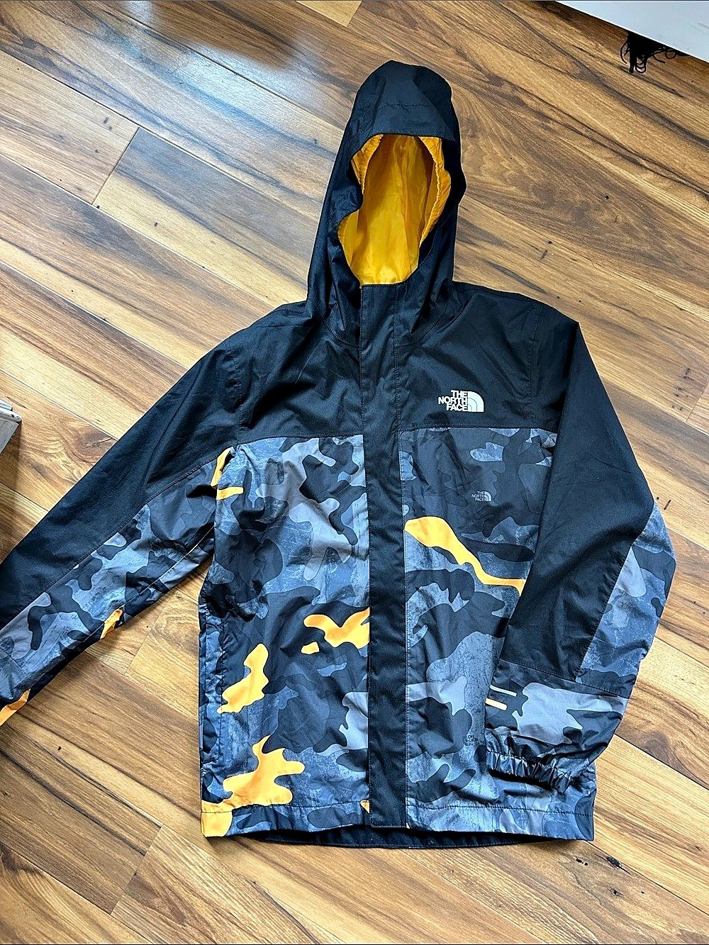 The North Face Boys Waterproof Hooded Rain Jacket Black Yellow Camo & Gray Camo